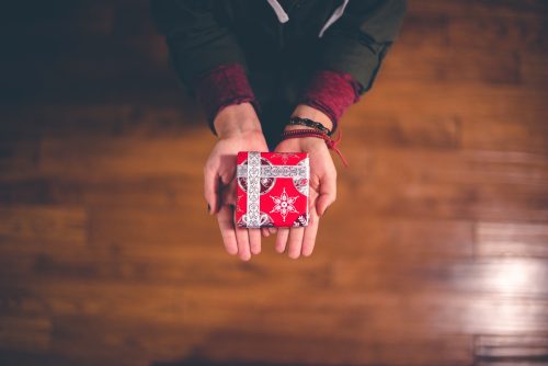 Handing a small Christmas present